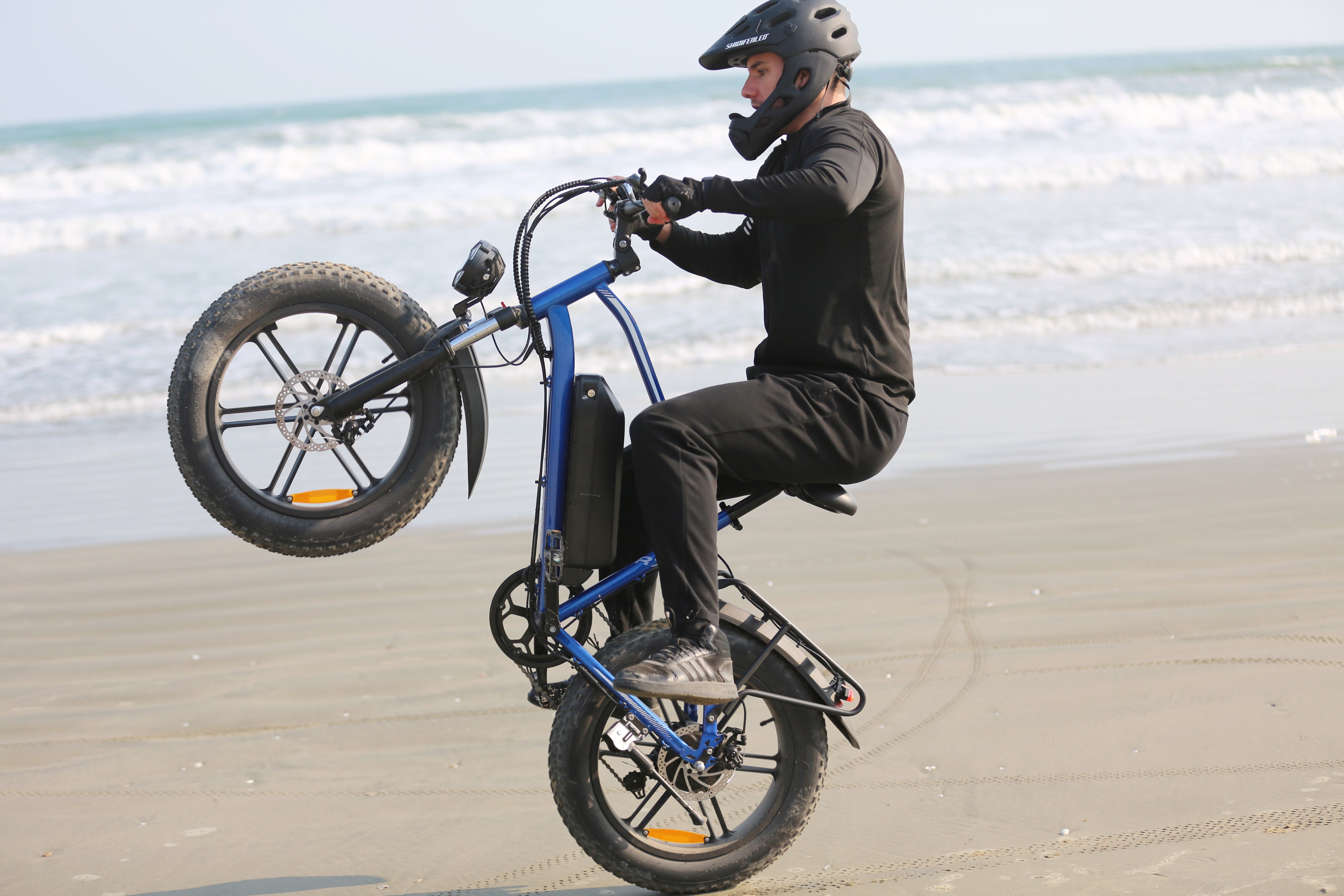 Riding an electric bicycle on the beach